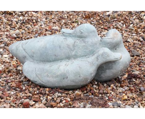 A hardstone garden sculpture,20th century, depicting a group of three seated ducks,65cm wide,45cm deepCondition ReportScuffs 
