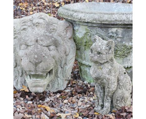 A composition planter,with moulded floral decoration, 59cm diameter47cm higha composition seated cat,37cm highand a compositi
