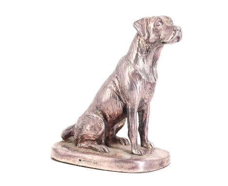 A silver cased model,by Camelot Silver Ltd, Sheffield 2013, of a seated labrador retriever, signed 'Donaldson',10.5cm highCon