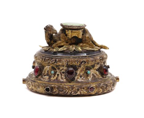 A continental silver gilt paperweight,early 20th century, possibly Austrian, in the manner of Bergmann, modeled as a recumben