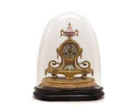 A French ormolu mantel clock,late 19th century, with a porcelain urn pediment, over a painted porcelain dial, enclosing a two