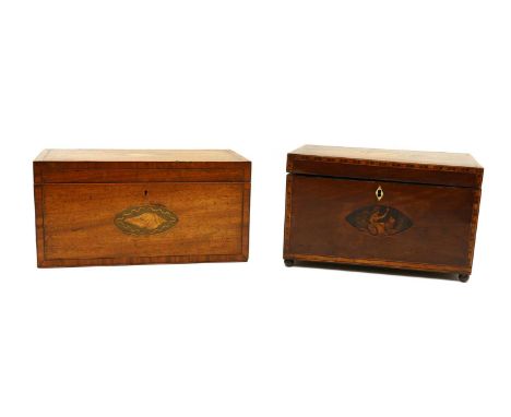 A Victorian mahogany tea caddy,with inlaid shell patera, opening to reveal a fitted interior and later blue glass mixing bowl