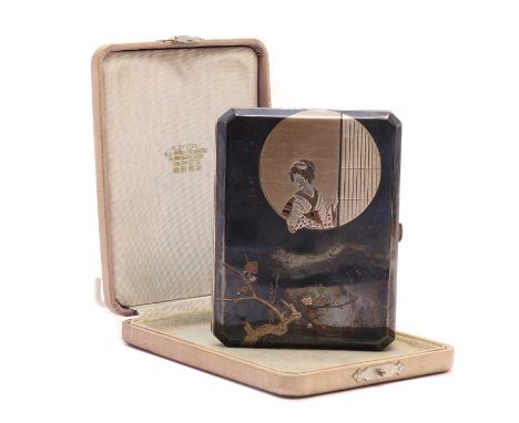 A cased Japanese metal cigarette case,by K. Uyeda, decorated with a circular panel depicting a geisha by a screen, and a flow