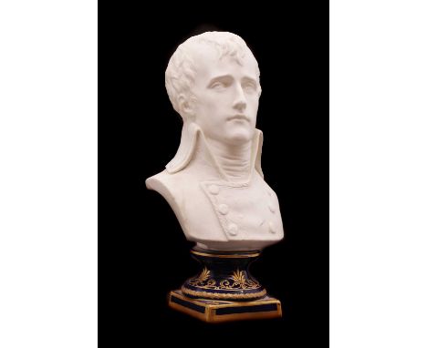 A small biscuit porcelain bust of Napoleon,late 19th to early 20th century, French, raised on a blue and gilt porcelain socle