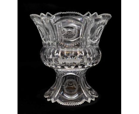 A large cut glass punch bowl and stand,first half 20th century, possibly American, with a mitre cut rim over a band of printi