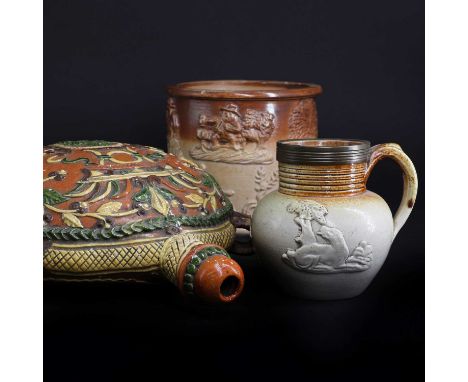 A pottery flask,late 19th century, Swiss, with moulded and coloured foliate decoration,22cm high, together with two stoneware