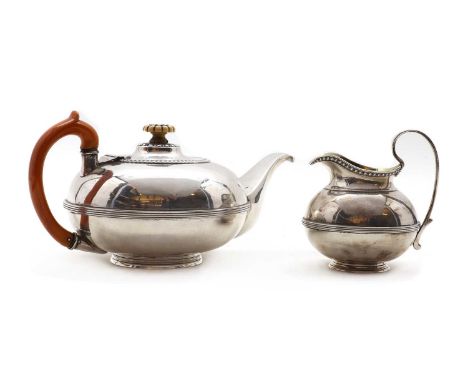 A Russian silver teapot84 zolotniki, maker's mark A H, St Petersberg (1818 - 1864), with an ivory finial, 23cm wide,together 