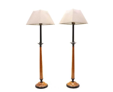 A pair of scumbled maple table lamps20th century, of slender candlestick design with conical shades 76.5cm high including sha