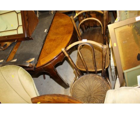 A pair of bentwood chairs; together with a set of four Ercol stick back chairs 
