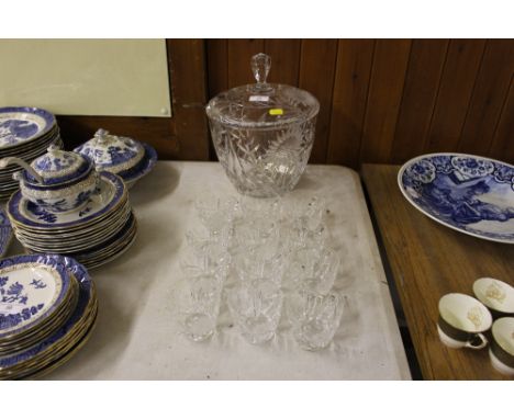 A crystal glass punch bowl with a set of twelve matching cups, and a silver plated ladle 