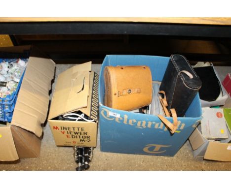A box containing two pairs of binoculars; a view editor; projector; tripods etc. 