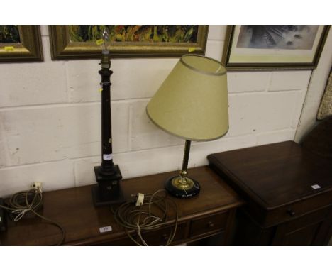 A brass Corinthian column table lamp and shade; together with a decorated hardwood table lamp