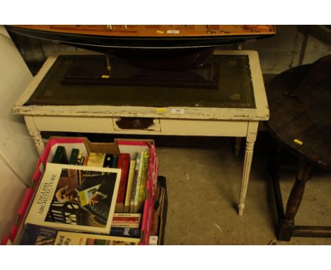 A white painted oblong coffee table with green leather inset top; and a constructable shelf unit 