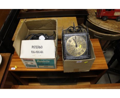 A colour slide projector - sold a collector's item; and a metal cased clock