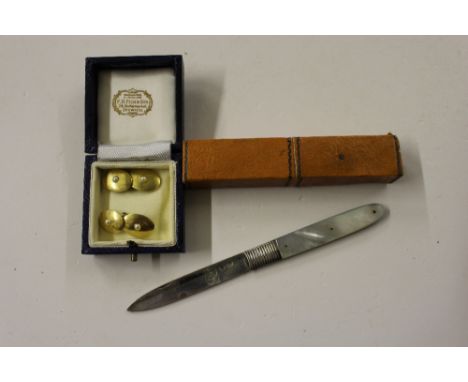 A 19th Century silver bladed and mother of pearl fruit knife; together with a pair of 18ct gold cuff-links