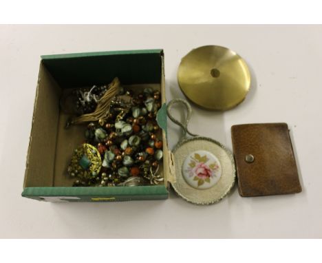 A box containing bead jewellery; a compact etc. 