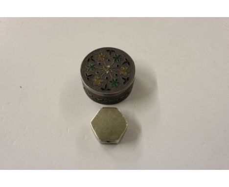 A white metal and enamel decorated pill box; and a small silver pill box 