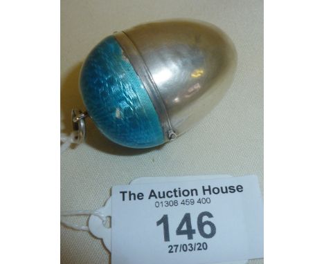 Silver guilloche enamel novelty powder compact in the shape of an acorn, or egg. Containing inset mirror and down powder puff