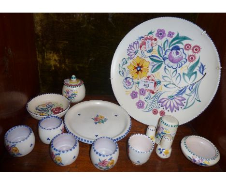 13 pieces of handpainted Poole Pottery, inc. eggcups, cruet set, etc. 