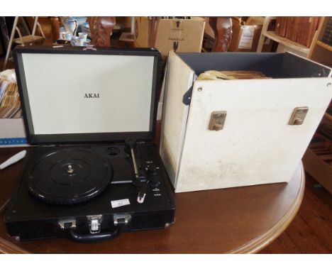 AKAI portable record player and a collection of jazz, blues and other 78 rpm records