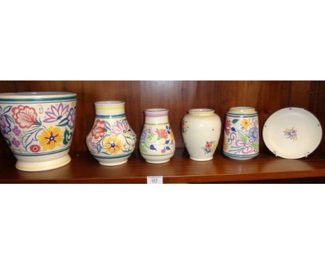 Poole pottery, a jardiniere, four vases and a plate