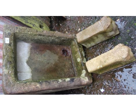 Old stone sink with two supports