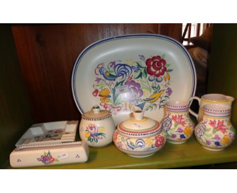 1950s hand-painted Poole Pottery items including a large platter decorated with birds (eight pieces)