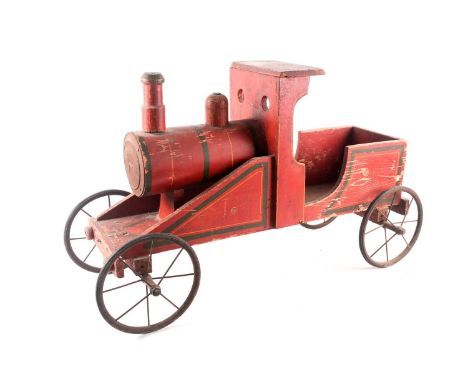 A vintage, presumably American folk art, crimson painted wood, pull along steam engine with spoked wheels. 72 cm long x 44 cm