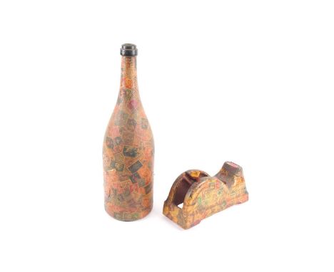 A mid 20th century decoupaged wine bottle appliqued with vintage and antique postage stamps, together with a similarly decora