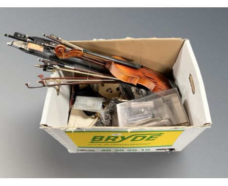 A box of violin bows, musical instrument parts, strings etc 