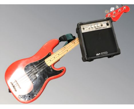 A bass guitar (as found) and an Acoustic Solutions mini amplifier with lead. 