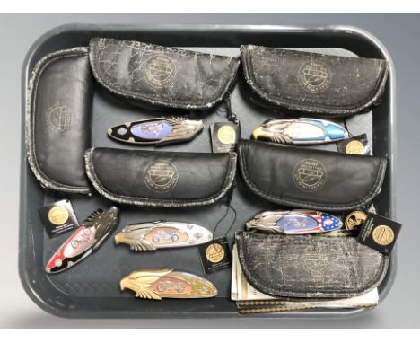 A group of modern folding knives depicting Harley Davidson motorcycles.