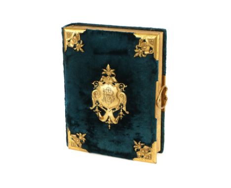 A Fine Victorian Cartes de Visite Album, bound in turquoise velvet with ornate gilt brass furniture, design registration mark
