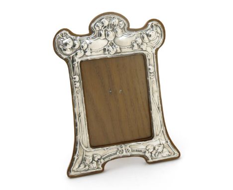 An Albert Jackson silver and wood photograph frame, stamped in low relief with stylised flowers and foliage on sinuous stems,