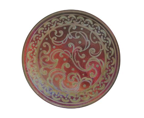 A Burmantofts Faience lustre wall plate by Joseph Walmsley, painted with scroll design, the rim with a border of painted link