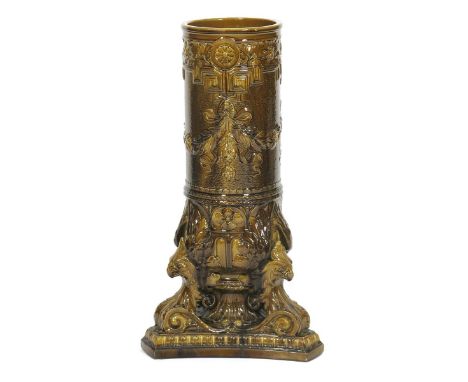 A Burmantofts Faience stickstand, model no.1868,  cylindrical form on flaring griffin tripod foot, cast in low relief with fl