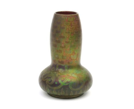 A Burmantofts Faience lustre vase by Joseph Walmsley,  compressed ovoid form with swollen cylindrical neck, painted with a ba