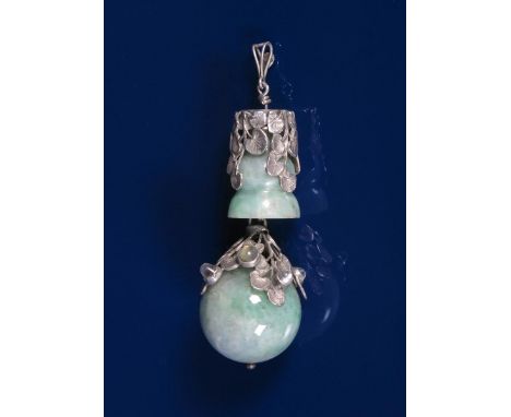 A large silver and jadeite pendant the design attributed to Amy Sandheim, cast sprays of foliage set with jade body, the larg