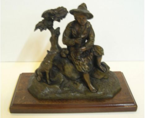 Early 20thC Bronze statue of Peasant boy at rest with his faithful dog , housed on wooden stand,21 x 20 cm 