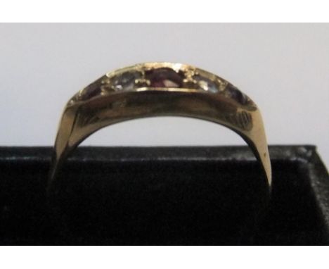 18ct yellow gold boat shaped ring with rubies & diamondsApprox 2.7 grams gross,        size O/P 