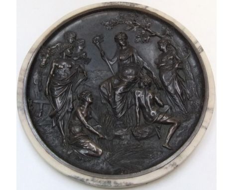 Antique bronze circular wall relief plaque in marble surround with foundry stamp versoThe plaque measures 21 cm in diameter 