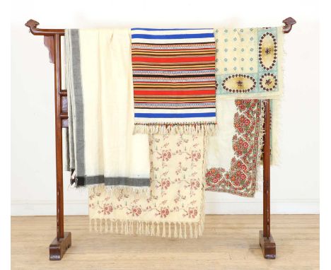 20th century, to include an Indian printed shawl with blue motifs, an Indian cream house cloth with woven black border, two I