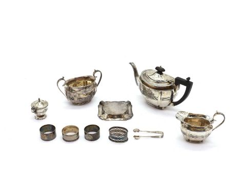 comprising a three piece tea service by George Nathan &amp; Ridley Hayes, Chester 1896, comprising a teapot, 13cm high, a twi