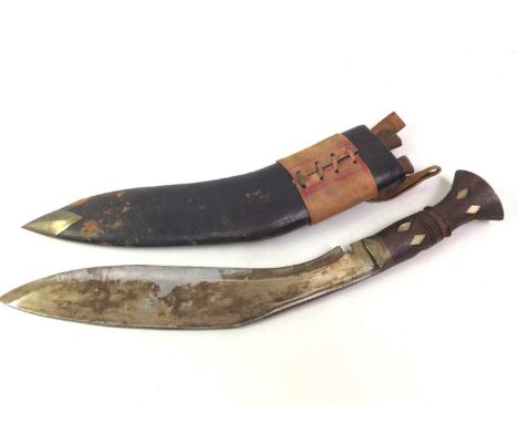 NEPALESE KUKRI, EARLY TO MID-20TH CENTURY with curved fullered steel blade, the turned grip inlaid in bone, the leather clad 