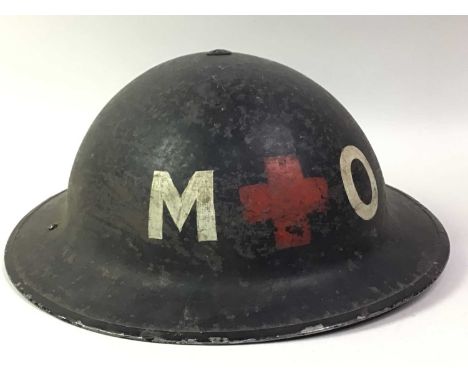 MEDICAL ORDERLY BRODIE-TYPE HELMET, WWII PERIOD painted M + O, numbered 1939 to interior, with webbing and cloth chinstrapAdd