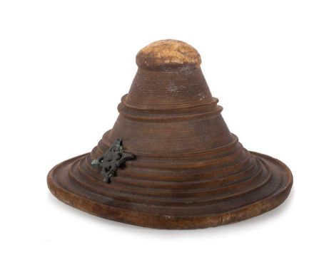 OMANI TRIBAL PARRYING SHIELD OR BUCKLER SHIELD, 19TH CENTURY  likely made in Zanzibar, in pressed and turned rhino hide, with