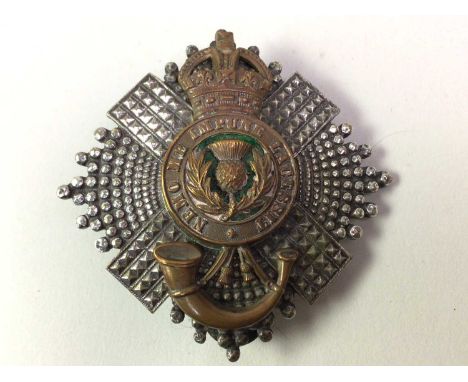 SCOTS GUARDS, HELMET BADGE  by Marshall &amp; Aitken of Edinburgh, the white metal surround with bronzed centre