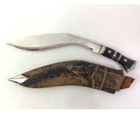 NEPALESE KUKRI KNIFE, 20TH CENTURY with curved steel blade over a steel mounted horn grip, with leather scabbard44.7cm long (