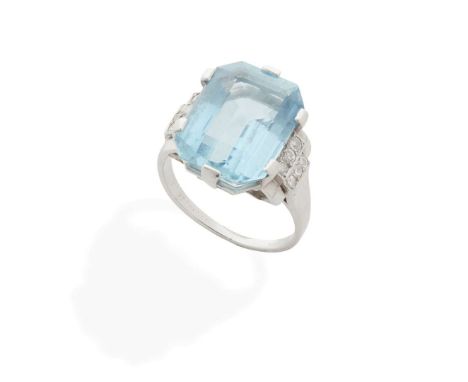  An aquamarine and diamond cocktail ring, 1930s  Claw-set with a rectangular step-cut aquamarine, each shoulder set with six 