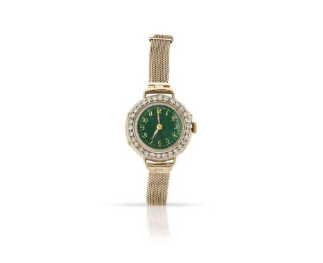  An early 20th century diamond cocktail watch  The green circular dial with Arabic numerals, the bezel set with rose-cut diam